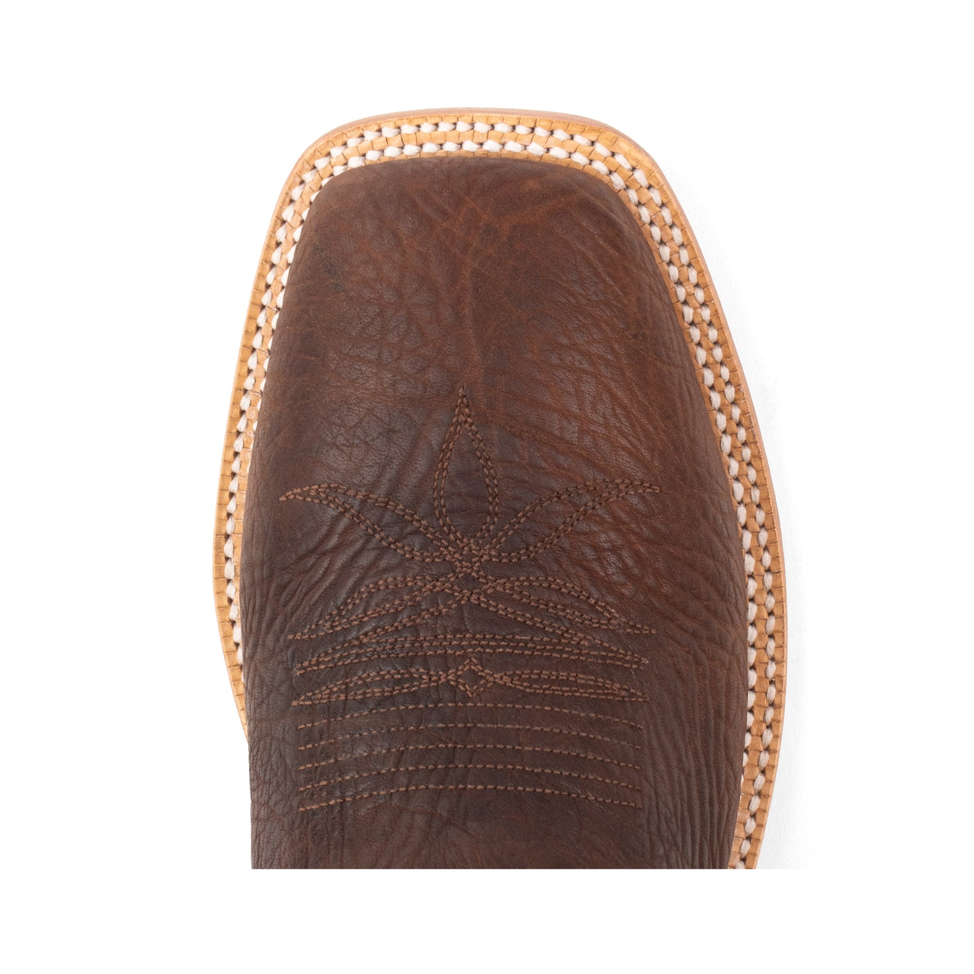 Close-up of a brown leather boot with intricate stitching on a white background